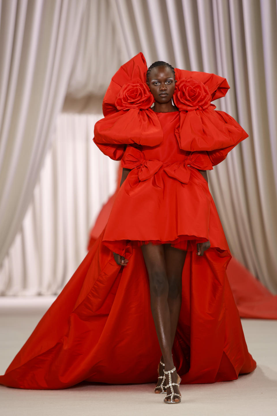 A model wears a creation as part of the Giambattista Valli Haute Couture Spring-Summer 2023 collection presented in Paris, Monday, Jan. 23, 2023. (AP Photo/Lewis Joly)