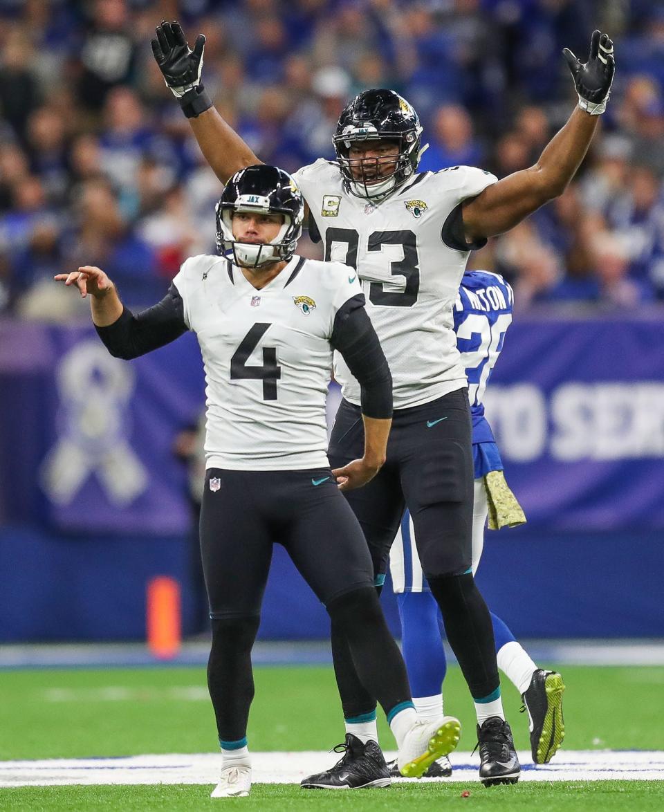 Jacksonville Jaguars defensive end Calais Campbell (93) celebrates a made field goal by teammate and kicker Josh Lambo (4) against the Indianapolis Colts at Lucas Oil Stadium on Sunday, Nov. 11, 2018. 