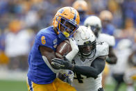 Pittsburgh wide receiver Aaron Mathews (6) tries to get away from Central Florida linebacker Nate Evans (44) after making a catch during the first half of an NCAA college football game, Saturday, Sept. 21, 2019, in Pittsburgh. (AP Photo/Keith Srakocic)