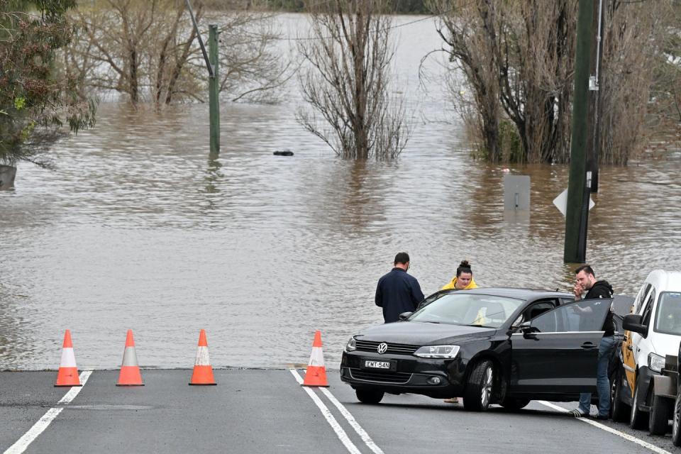 <span class="caption">Floods frequently cut off major access roads.</span> <span class="attribution"><span class="source">Mick Tsikas/AAP</span></span>