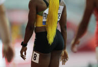 Shelly-Ann Fraser-Pryce, of Jamaica, finishes a the women's 100 meter heat at the World Athletics Championships in Doha, Qatar, Saturday, Sept. 28, 2019. (AP Photo/Petr David Josek)