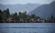 Empty houseboats are seen at Dal lake in Srinagar,