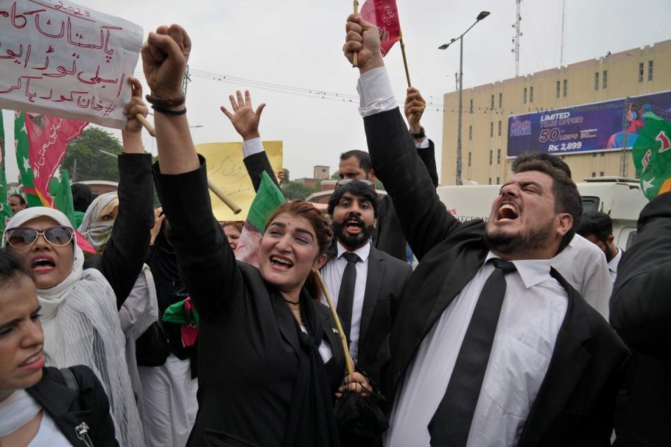 Lawyers chant slogans during a protest against Khan’s imprisonment (AP)