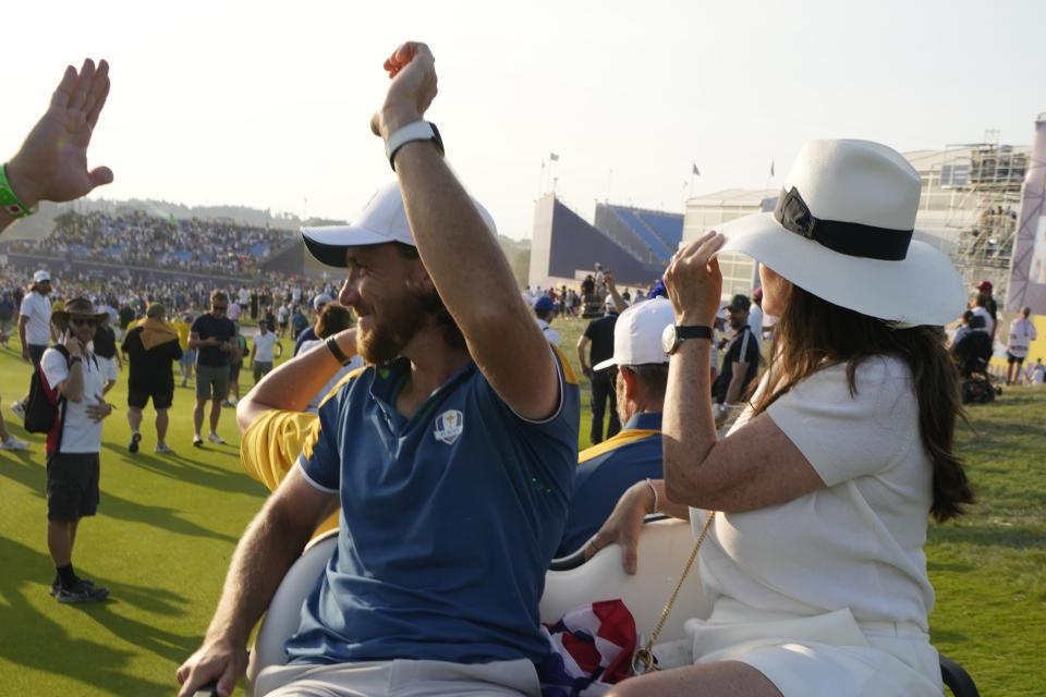 Europe's Tommy Fleetwood waves to the crowd after Europe won the Ryder Cup at the end of the final days singles matches at the Ryder Cup golf tournament at the Marco Simone Golf Club in Guidonia Montecelio, Italy, Sunday, Oct. 1, 2023. (AP Photo/Andrew Medichini)