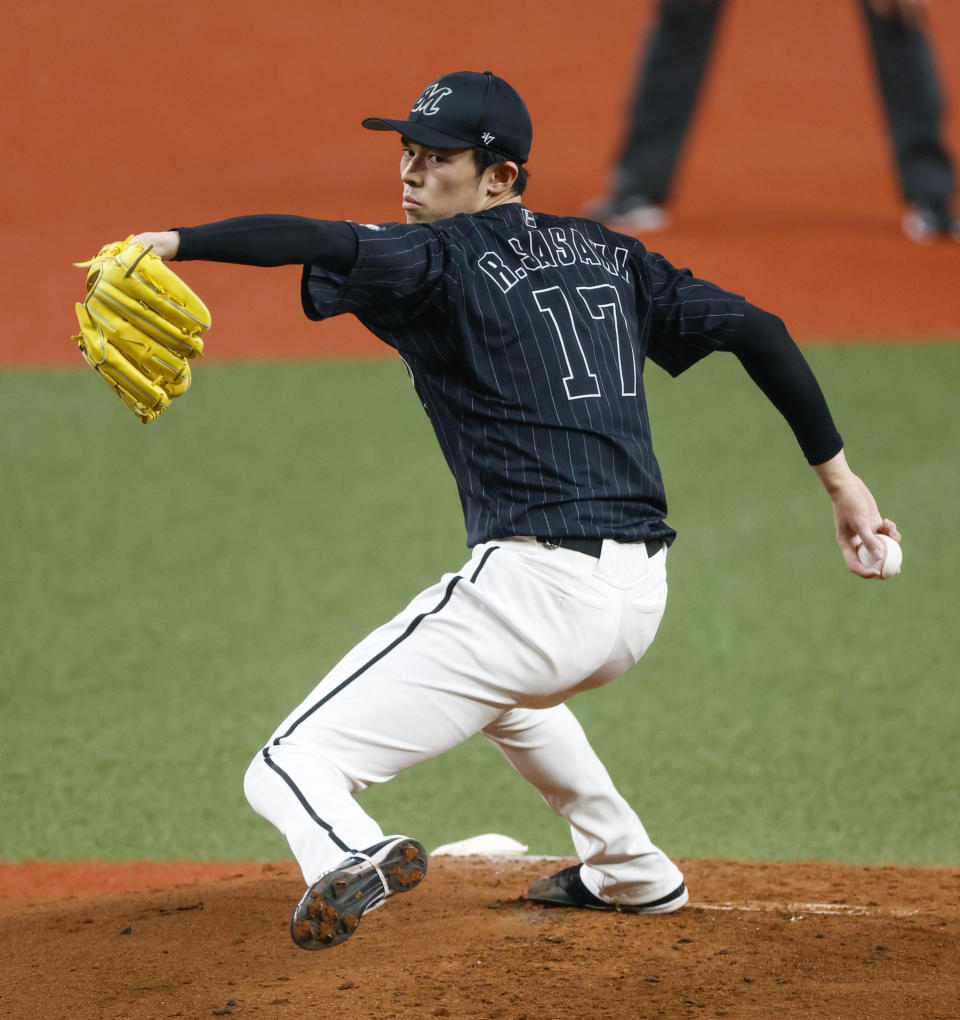 Chiba Lotte Marines Roki Sasaki pitches during a game against the Orix Buffaloes in Osaka, western Japan, Sunday, April 24, 2022. (Kyodo News via AP)