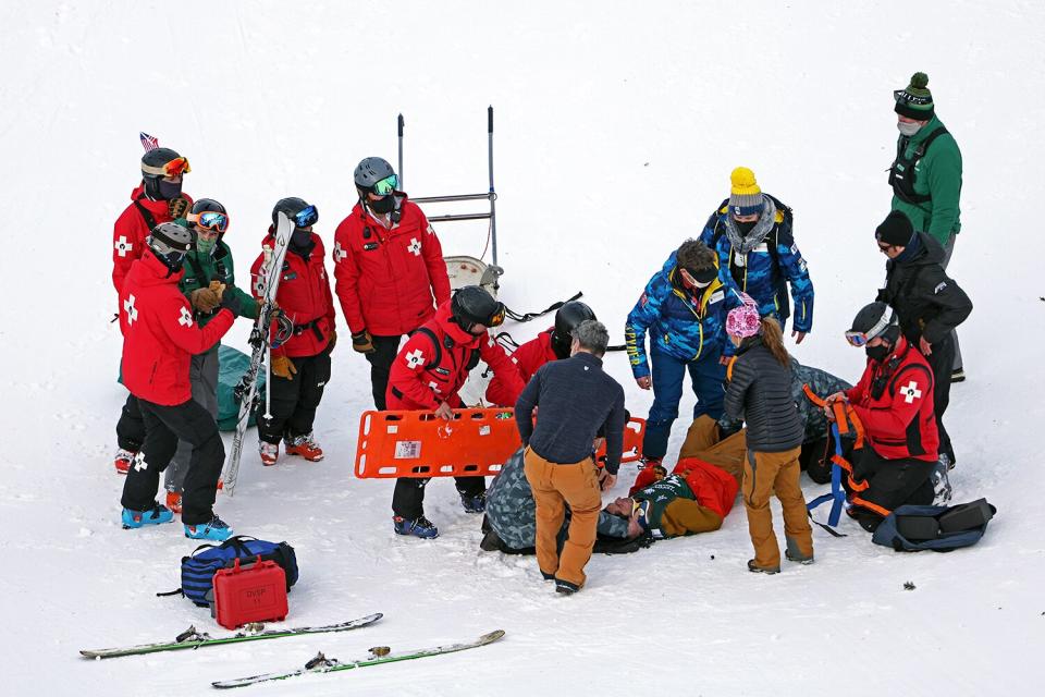 George McQuinn of Team USA is placed on a stretcher after a crash during his run for the Men's Mogul Finals during the Intermountain Healthcare Freestyle International Ski World Cup at Deer Valley Resort on January 13, 2022 in Park City, Utah.