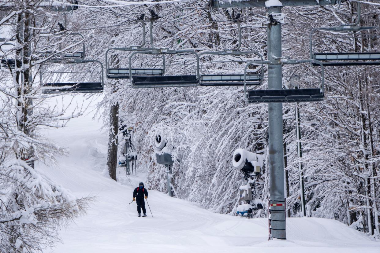 A skier makes his way to a quad lift at Granite Peak Ski Area in Wausau on Dec. 21, 2022.