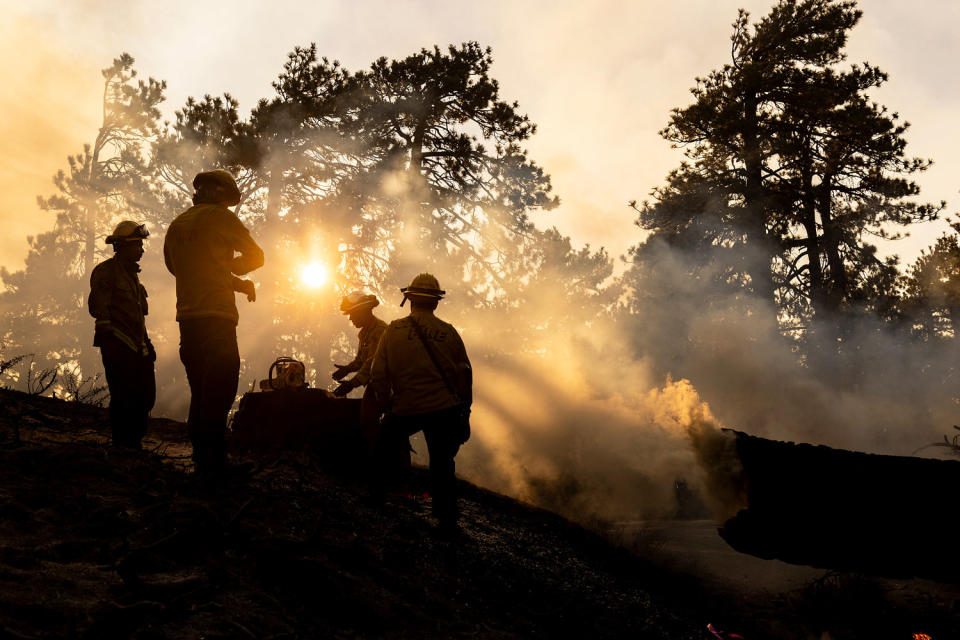 Image: Fire on bridge in California Firefighters smoke (Etienne Laurent / AFP - Getty Images)