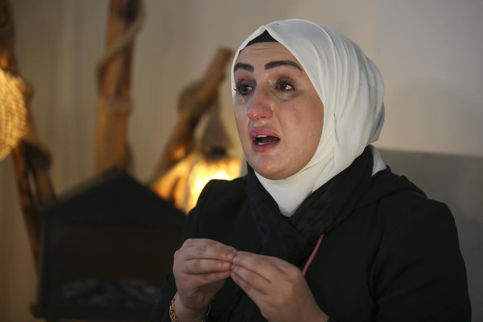 Fatima Alzahra Shon, 32, a Syrian refugee talks to The Associated Press during an interview in Istanbul, Friday, Sept. 17, 2021. Fatima Alzahra Shon thinks neighbors attacked her and her son in their Istanbul apartment building because she is Syrian. The 32-year-old refugee from Aleppo was confronted on Sept. 1 by a Turkish woman who asked her what she was doing in "our" country. Shon replied, "Who are you to say that to me?" The situation quickly escalated.(AP Photo/Emrah Gurel)