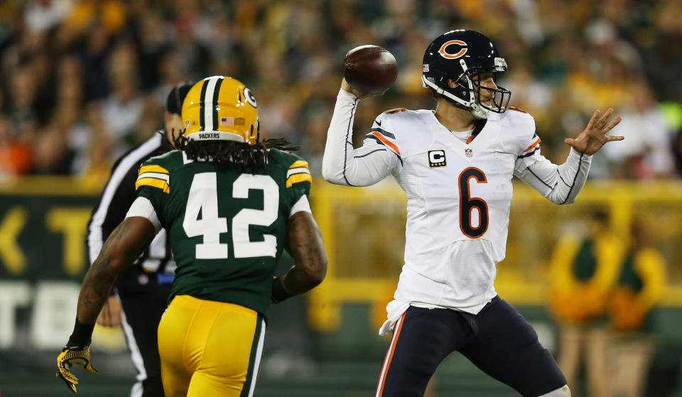 GREEN BAY, WI - SEPTEMBER 13: Quarterback Jay Cutler #6 of the Chicago Bears looks turnover pass under pressure from free safety Morgan Burnett #42 of the Green Bay Packers in the second quarter at Lambeau Field on September 13, 2012 in Green Bay, Wisconsin. (Photo by Jonathan Daniel/Getty Images)