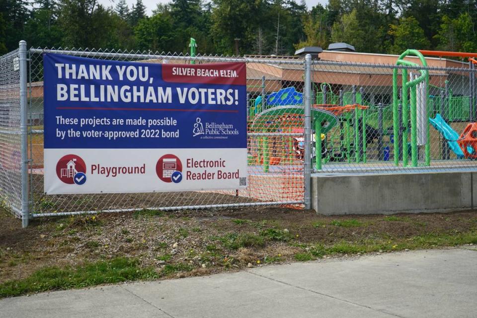 A sign posted in front of the newly finished inclusive playground at Silver Beach Elementary School on Sept. 6, 2023, thanks voters for approving the bond that funded the project in Bellingham, Wash. Rachel Showalter/The Bellingham Herald