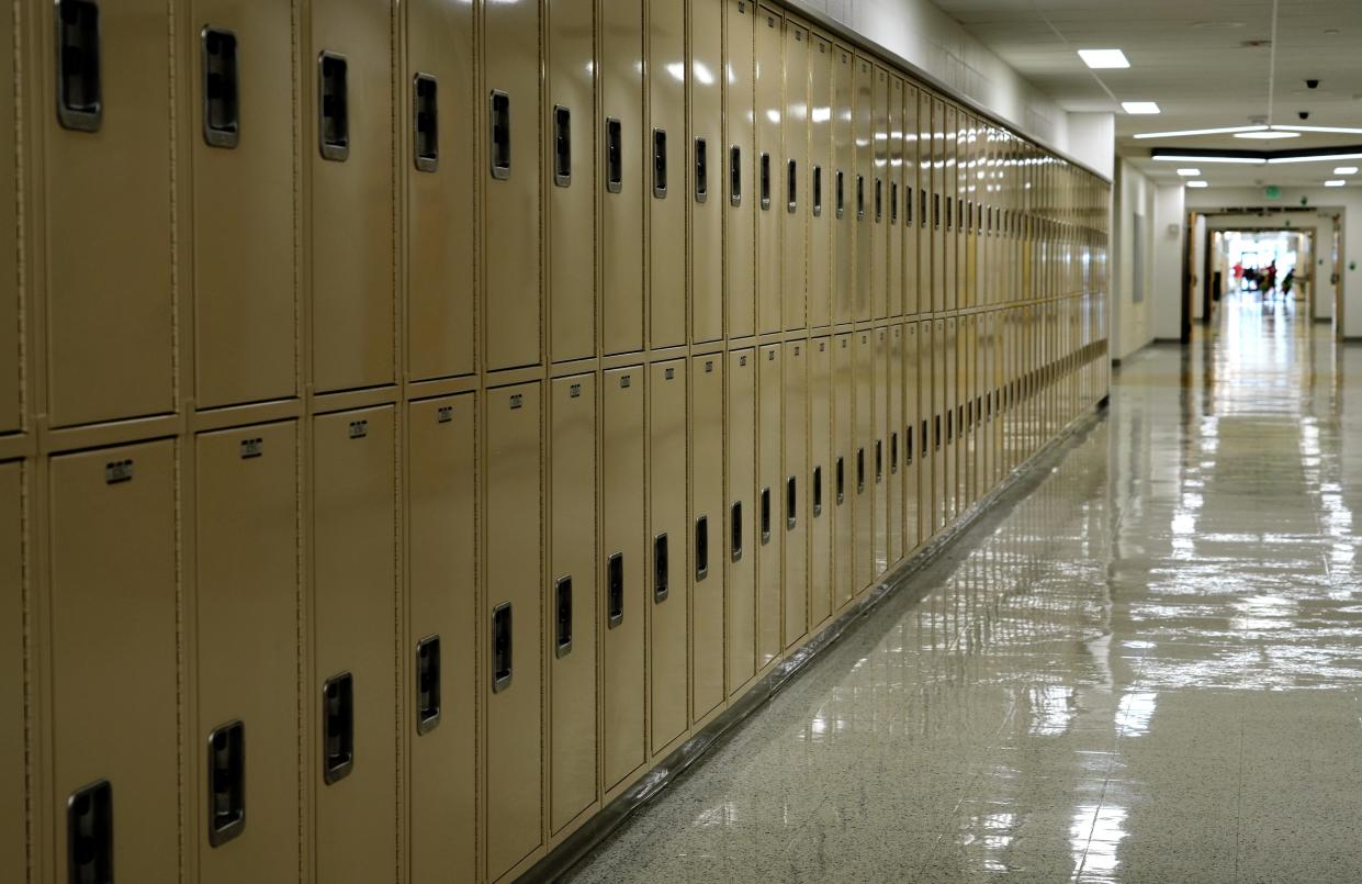 Lockers line the hall at Mason Middle School before the start of the new school year. Mason and other southwest Ohio school districts found out Friday how they did on the annual state report cards, which measure school districts' performance.