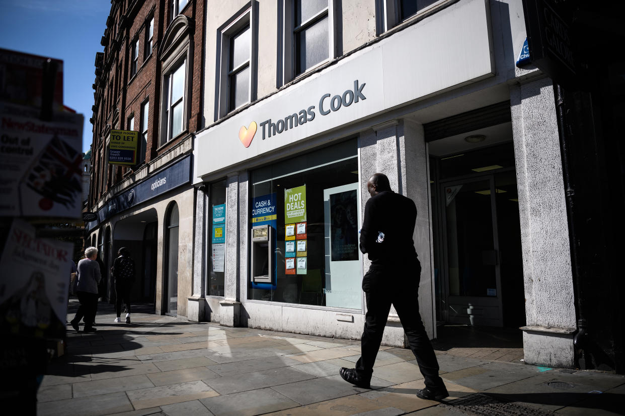 LONDON, ENGLAND - SEPTEMBER 20: Shoppers walk past a branch of travel agent chain Thomas Cook on September 20, 2019 in London, England. Banks are insisting that the company finds £200m more in extra contingency funds, or it faces the prospect of falling into administration. If the company does collapse, around 150,000 holiday-makers would need to be repatriated from their current locations. (Photo by Leon Neal/Getty Images)