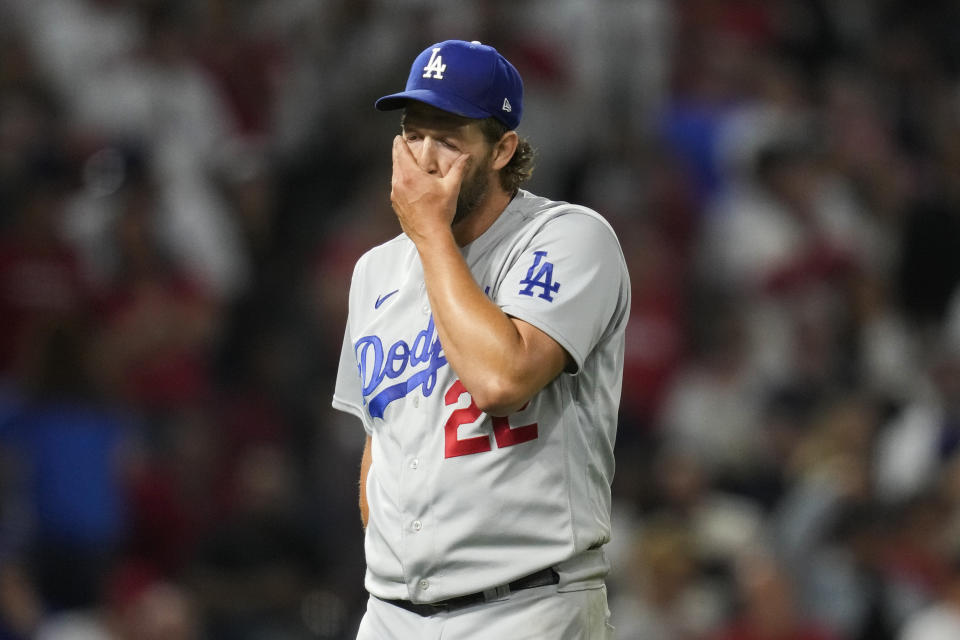 Los Angeles Dodgers starting pitcher Clayton Kershaw (22) reacts as he returns to the dugout after the seventh of a baseball game against the Los Angeles Angels in Anaheim, Calif., Tuesday, June 20, 2023. (AP Photo/Ashley Landis)