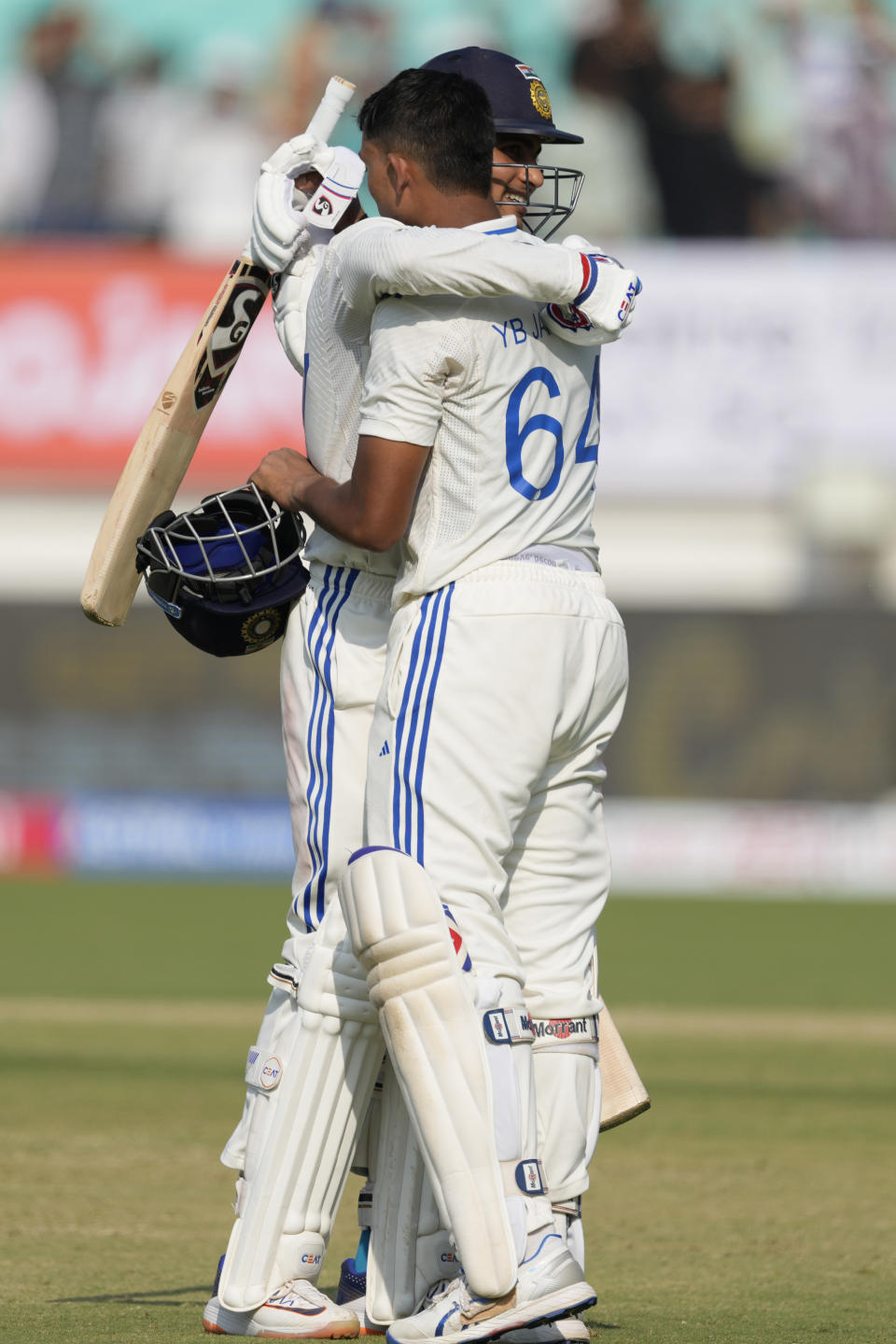 India's Yashasvi Jaiswal, right, is congratulated by teammate Shubman Gill after he scored century on the third day of the third cricket test match between England and India in Rajkot, India, Saturday, Feb. 17, 2024. (AP Photo/Ajit Solanki)