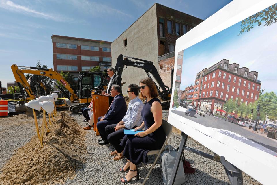 A rendering of the future building can be seen to the right as Steve Beauregard, President of the New Bedford Development Corporation, speaks during the groundbreaking to officially launch construction of a new five-story mixed commercial and residential building on Union Street in New Bedford.