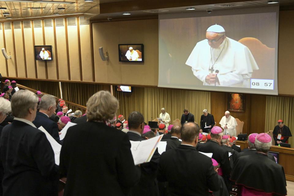 Pope Francis, standing at the bottom second from right, prays at the start of a sex abuse prevention summit, at the Vatican, Thursday, Feb. 21, 2019. The gathering of church leaders from around the globe is taking place amid intense scrutiny of the Catholic Church's record after new allegations of abuse and cover-up last year sparked a credibility crisis for the hierarchy. (Vincenzo Pinto/Pool Photo via AP)