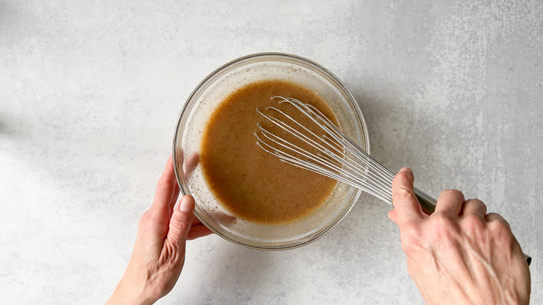 Whisking liquid ingredients for vegan carrot cake