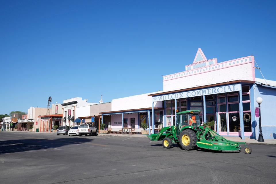 A prison laborer drives a loader/mower through Willcox on June 22, 2022. The city relies on cheap labor from prisoners to keep its taxes low.