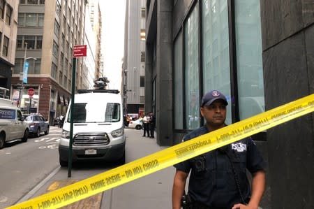 New York City police officers are seen as police said they were investigating two suspicious packages at the Fulton St. subway station in Manhattan