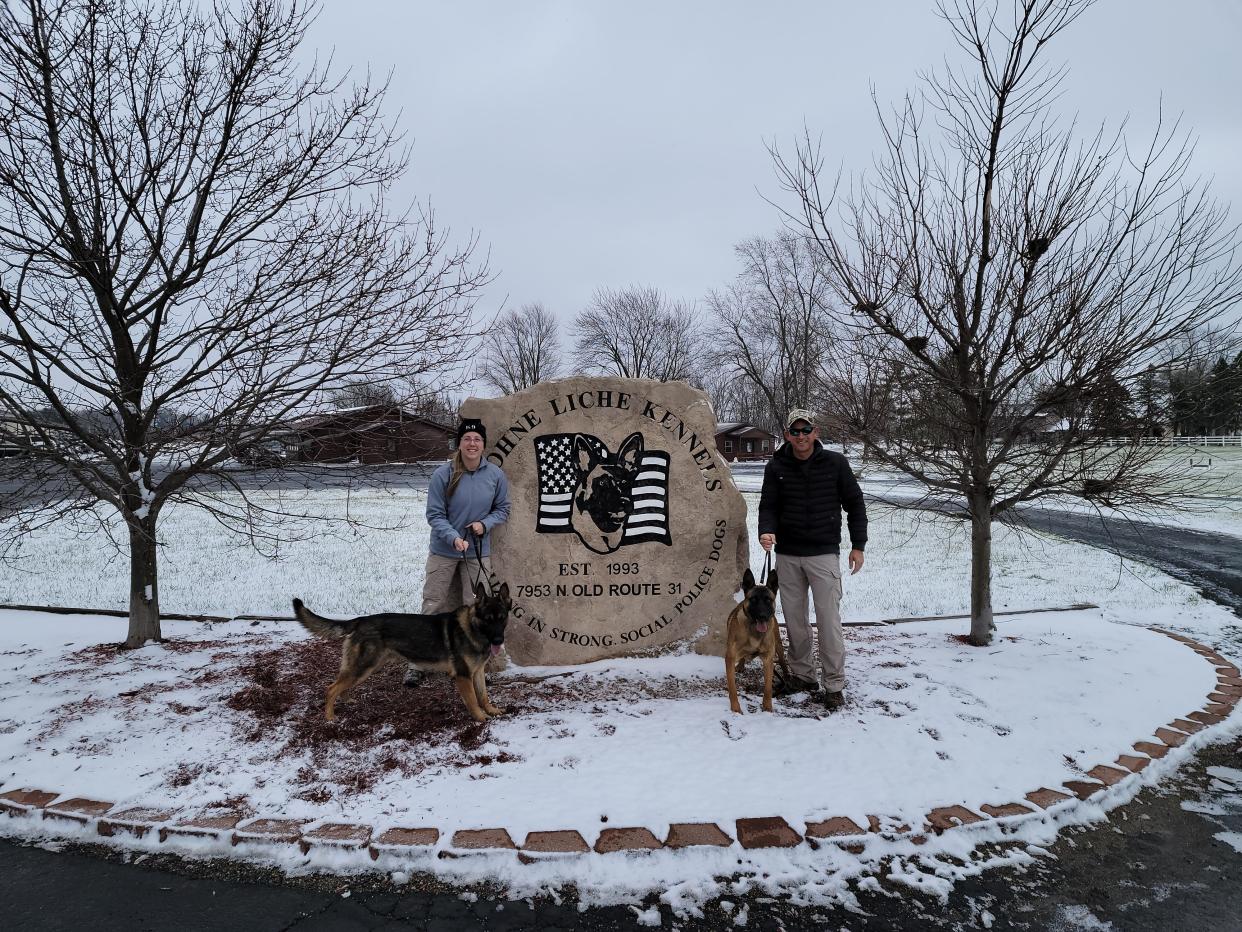 Windsor Police Department Officer Clara Steingart and her K9 partner, Zuma, (left) and Officer Marshal Allen and his K9 partner, Xaros, pose for a photo. Zuma and Xaros are the department's first dogs in its K9 unit.