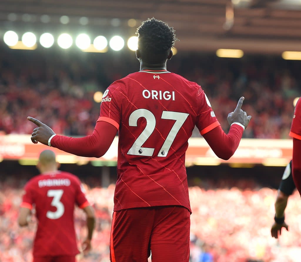 Divock Origi celebrates scoring against Everton at Anfield  (Getty)