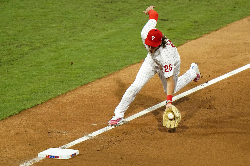 Philadelphia Phillies third baseman Alec Bohm fields a single by New York Mets' Amed Rosario during the fourth inning of a baseball game, Friday, Aug. 14, 2020, in Philadelphia. (AP Photo/Matt Slocum)