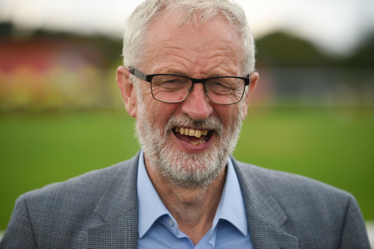 Britain's main opposition Labour Party leader Jeremy Corbyn talks with residents and members of the emergency services in the town of Whaley Bridge in northern England on August 5, 2019 during a visit to see the emergency operation to secure the damaged Toddbrook Reservoir dam and the town. - Emergency services continued to work at a reservoir in central England that threatens to flood an entire town, following further heavy rain. (Photo by Oli SCARFF / AFP)        (Photo credit should read OLI SCARFF/AFP/Getty Images)