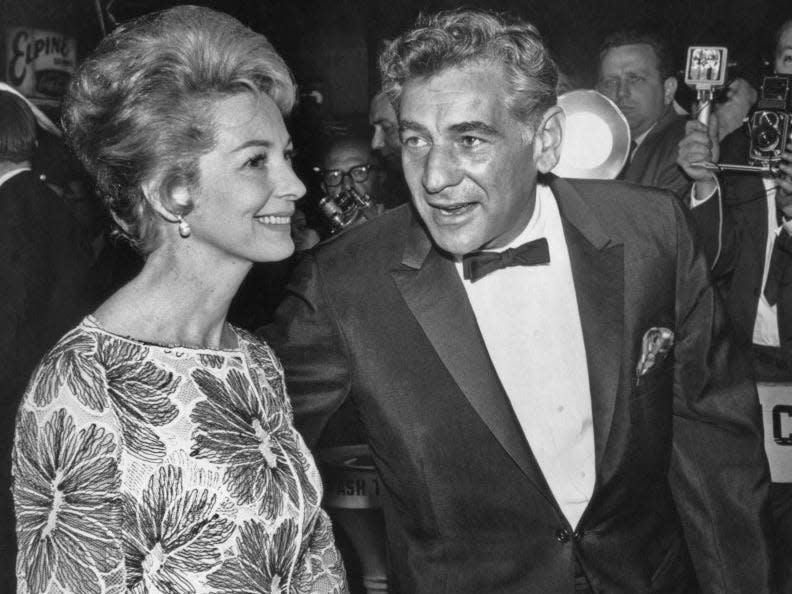 American composer and conductor Leonard Bernstein (1918 - 1990) and his wife actress Felicia Montealegre (1922 - 1978) at the New York film premiere of 'Cleopatra' on June 12, 1963.