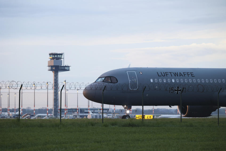 An Air Force Airbus carrying German citizens evacuated from Sudan lands at Berlin Brandenburg Airport in Schonefeld, Germany, Monday, April 24, 2023. (J'rg Carstensen/dpa via AP)