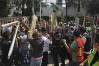 <p>Volunteers bring pieces of wood to help prop up sections of the collapsed Enrique Rebsamen school, as rescue workers search for children trapped inside, in Mexico City, Tuesday, Sept. 19, 2017.(Photo: Carlos Cisneros/AP) </p>