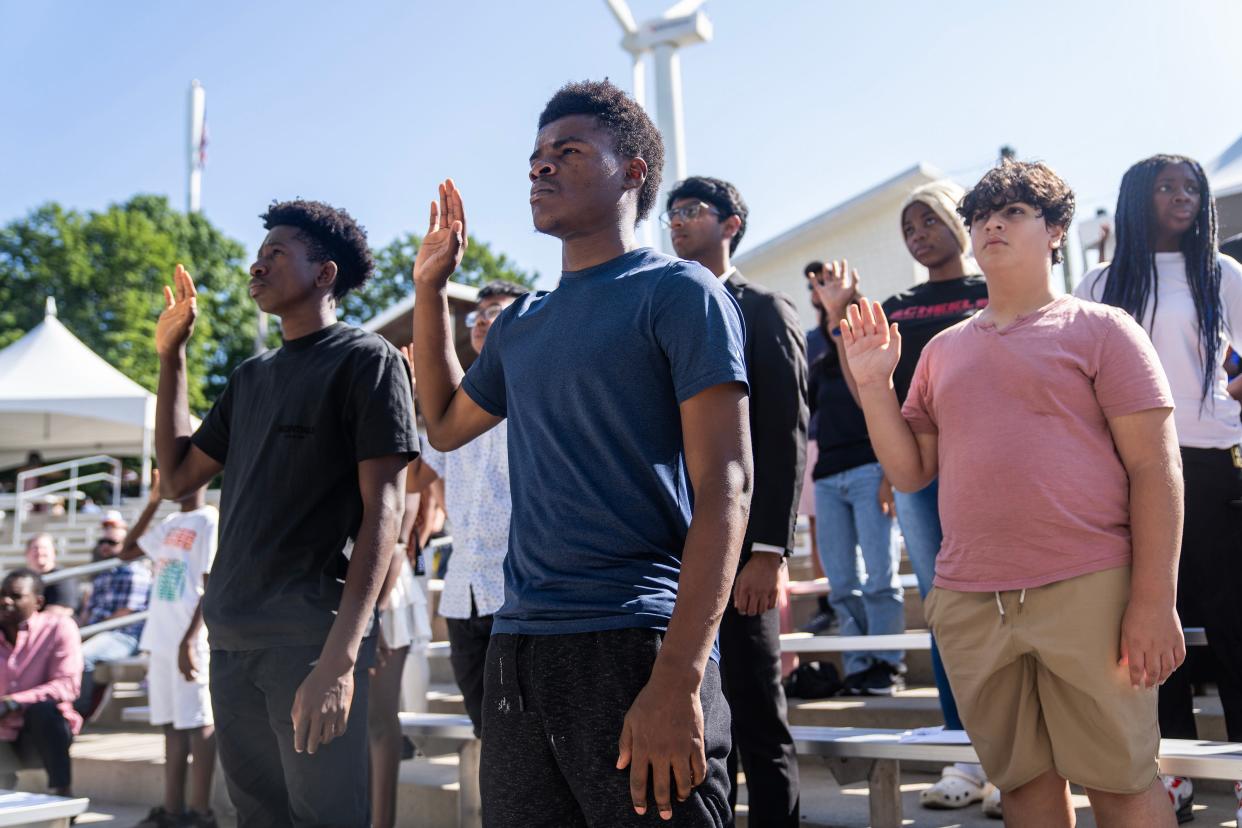 New U.S. citizens say the oath of allegiance during the children's citizenship ceremony at the Iowa State Fair.