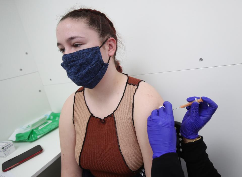 Woman receives vaccine (PA Wire)