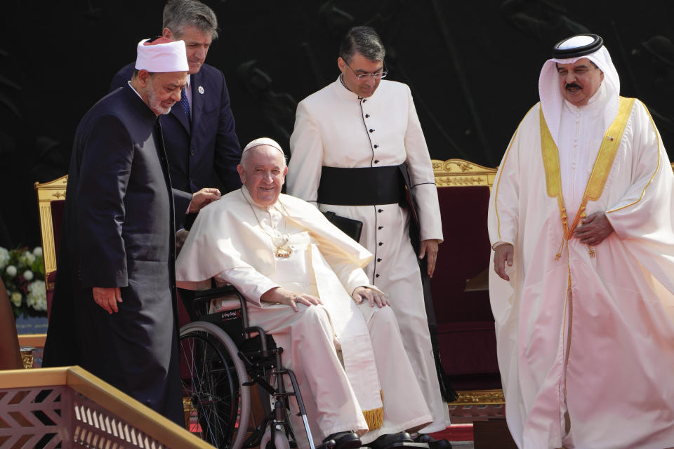 From left, Ahmed El-Tayeb, Grand Imam of al-Azhar, Pope Francis and Bahrain's King Hamad bin Isa Al Khalifa attend the closing session of the "Bahrain Forum for Dialogue: East and west for Human Coexistence", at the Al-Fida square at the Sakhir Royal palace, Bahrain, Friday, Nov. 4, 2022. Pope Francis is making the November 3-6 visit to participate in a government-sponsored conference on East-West dialogue and to minister to Bahrain's tiny Catholic community, part of his effort to pursue dialogue with the Muslim world. (AP Photo/Hussein Malla)