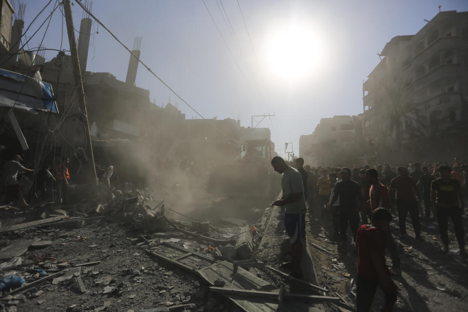 Palestinians look for survivors after an Israeli airstrike in Rafah, Gaza Strip, Thursday, Oct. 26, 2023. (AP Photo/Hatem Ali)