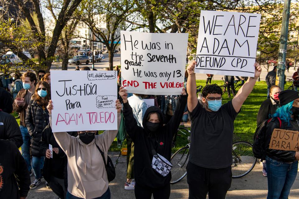 Activists protest near Mayor Lori Lightfoot's home in Chicago after the release of body camera footage that showed a police officer fatally shooting Adam Toledo, 13, in late March.
