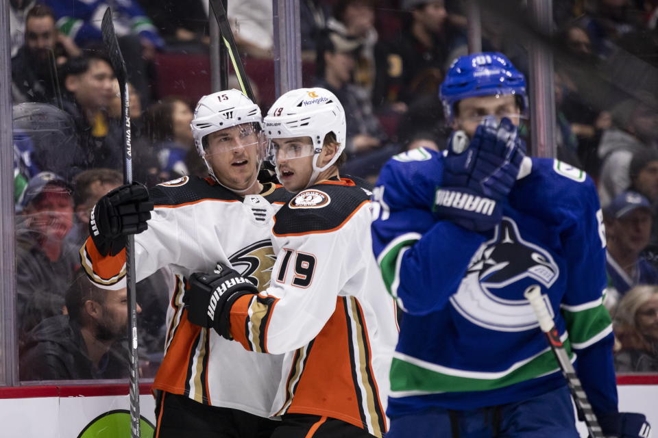 Anaheim Ducks' Ryan Strome (16) celebrates his goal against the Vancouver Canucks with Troy Terry (19) during the second period of an NHL hockey game Thursday, Nov. 3, 2022, in Vancouver, British Columbia. (Ben Nelms/The Canadian Press via AP)