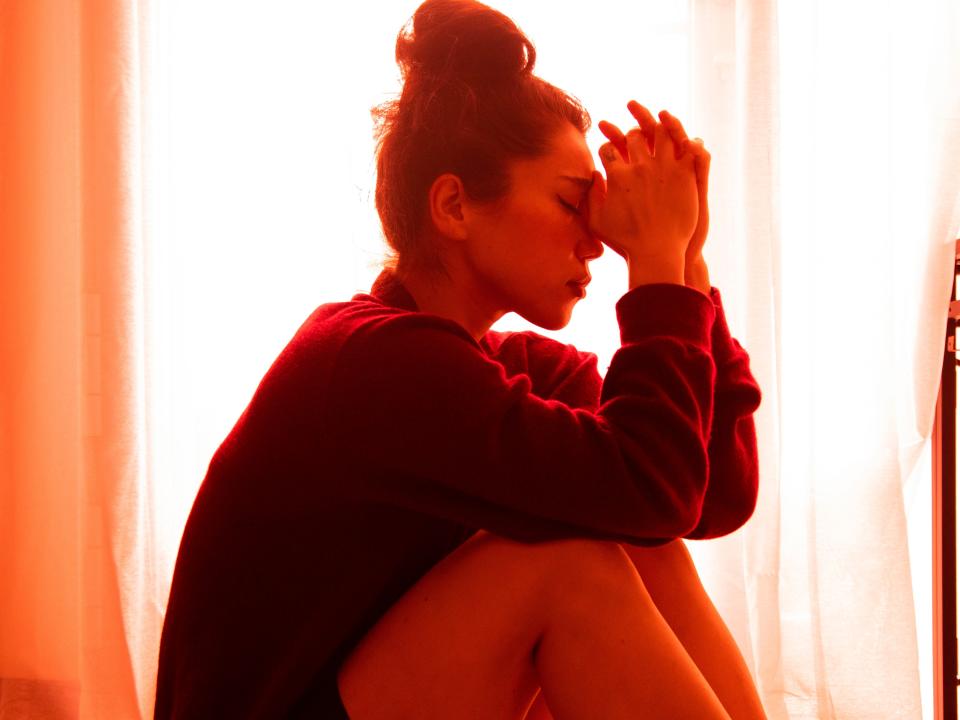 woman sitting with depressed pose