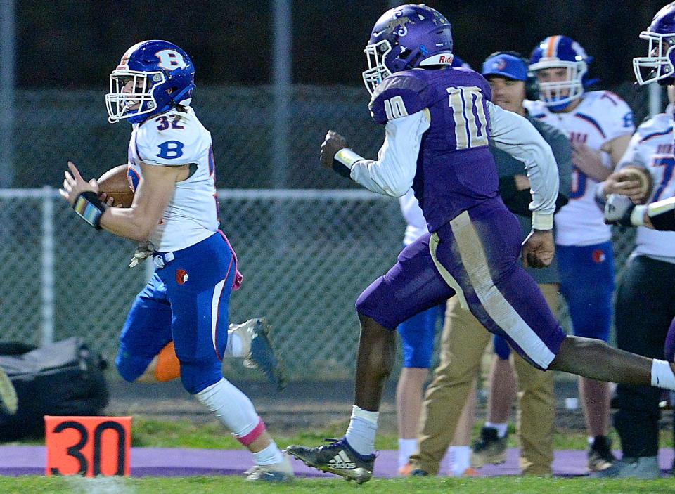 Boonsboro's Wyatt Jervis carries the ball, getting a first down for the Warriors during Friday night's game against Smithsburg.