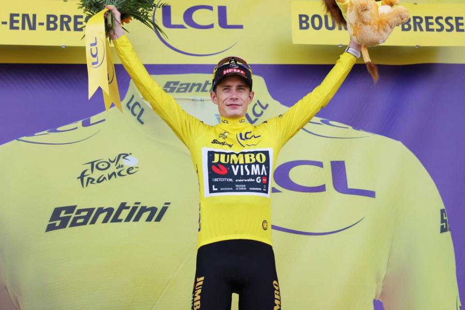 JumboVismas Danish rider Jonas Vingegaard celebrates on the podium with the overall leaders yellow jersey after the 18th stage of the 110th edition of the Tour de France cycling race 184 km between Moutiers and BourgenBresse in the French Alps on July 20 2023 Photo by Thomas SAMSON  AFP Photo by THOMAS SAMSONAFP via Getty Images