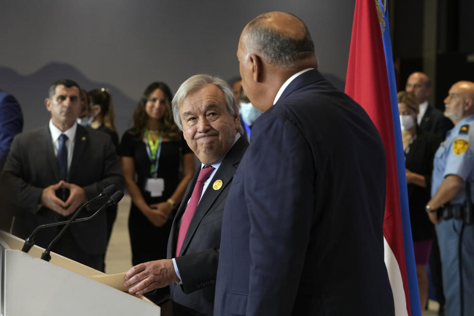 United Nations Secretary-General Antonio Guterres, left, looks at Sameh Shoukry, president of the COP27 climate summit during the summit, Thursday, Nov. 17, 2022, in Sharm el-Sheikh, Egypt. (AP Photo/Peter Dejong)