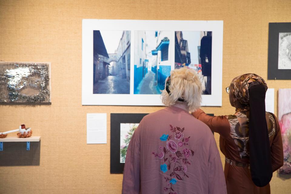 Students view the art on display at a Charles Allis Art Museum exhibit curated by Rufus King High School art students in May 2018.