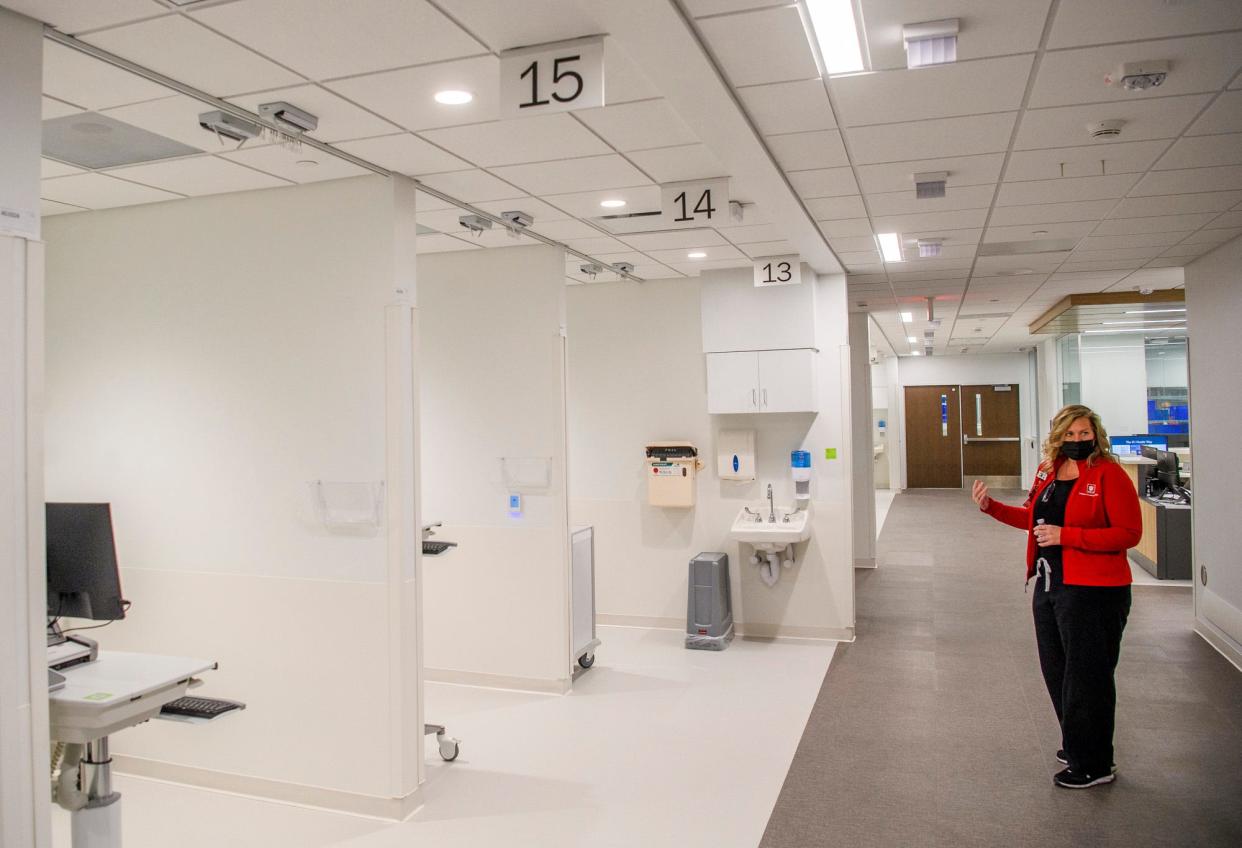 Director of Emergency and Trauma Services for IU Health Bloomington Katy Howe leads a tour of the emergency room area during the media event for the opening of the IU Health Bloomington Hospital and the Regional Academic Health Center on Wednesday, Dec. 1, 2021.