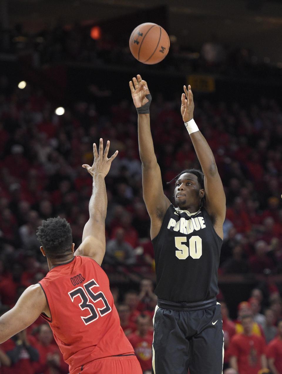 Purdue forward Caleb Swanigan (50) shoots against Maryland forward Damonte Dodd (35) during the first half of an NCAA basketball game, Saturday, Feb. 4, 2017, in College Park, Md. (AP Photo/Nick Wass)