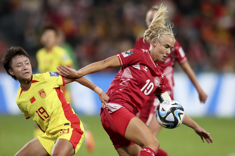 China's Zhang Linyan, left, vies for the ball with Denmark's Pernille Harder during the Women's World Cup Group D soccer match between Denmark and China at Perth Rectangular Stadium, in Perth, Australia, Saturday, July 22, 2023. (AP Photo/Gary Day)