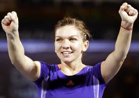 Simona Halep of Romania celebrates after winning the singles tennis final match at the WTA Dubai Tennis Championships February 21, 2015. REUTERS/Ahmed Jadallah