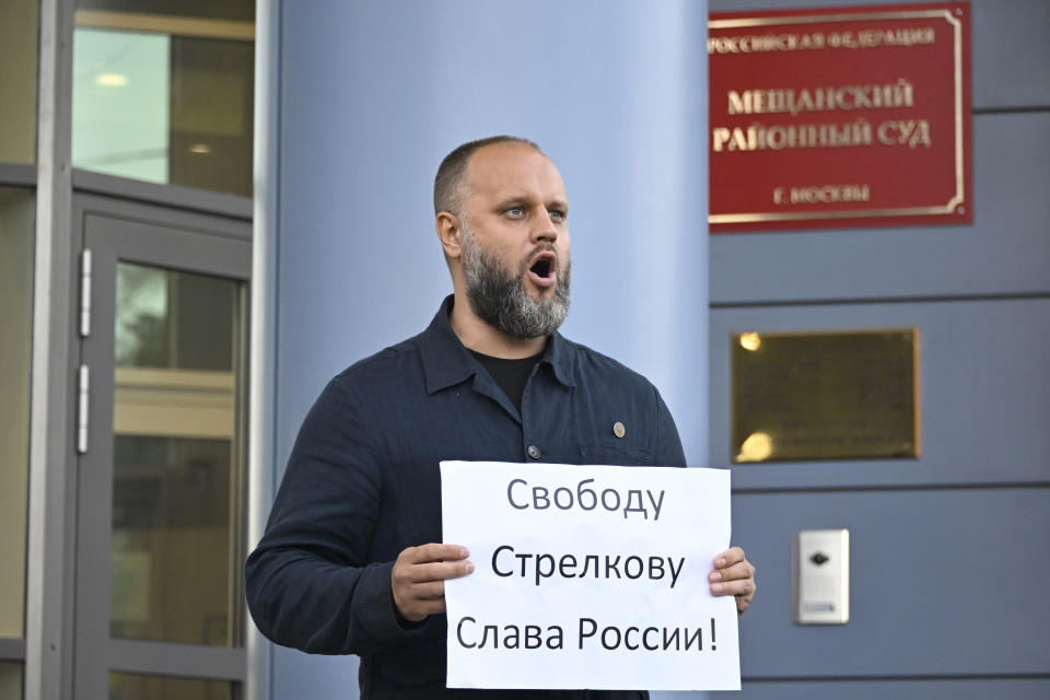 Pavel Gubarev, an activist of the "Club of Angry Patriots" nationalist group pickets outside the Meshchansky Court with a poster reading "Freedom to Strelkov, Glory to Russia!" during a hearing on the pre-trial arrest of Igor Strelkov, a retired security officer who led Moscow-backed separatists in eastern Ukraine in 2014, in Moscow, Russia, Friday, July 21, 2023. (Alexander Nemenov/Pool Photo via AP)