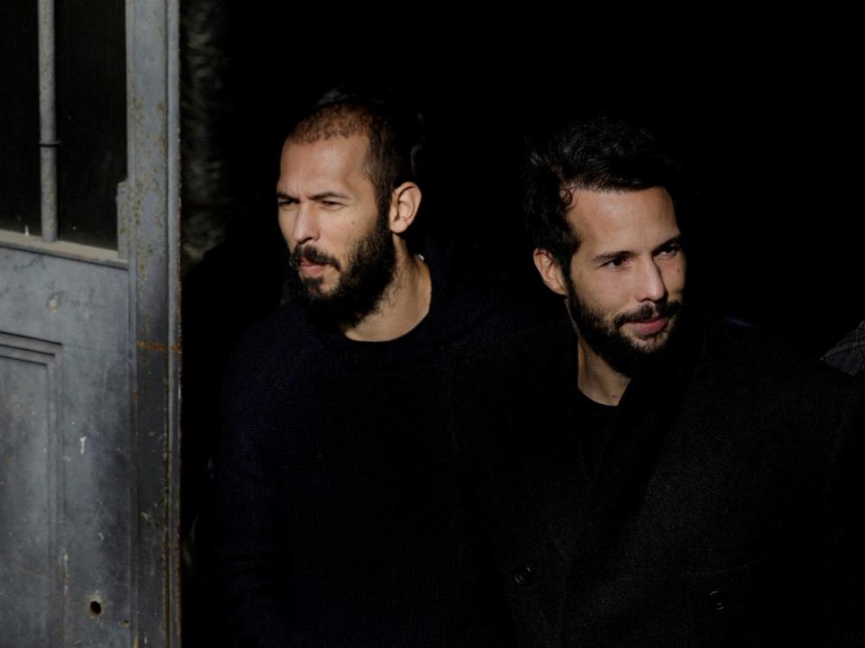 Andrew Tate and Tristan Tate outside the Bucharest Court of Appeal (via REUTERS)