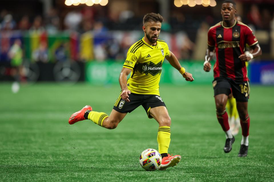 Jul 20, 2024; Atlanta, Georgia, USA; Columbus Crew forward Diego Rossi (10) handles the ball against the Atlanta United in the second half at Mercedes-Benz Stadium. Mandatory Credit: Brett Davis-USA TODAY Sports