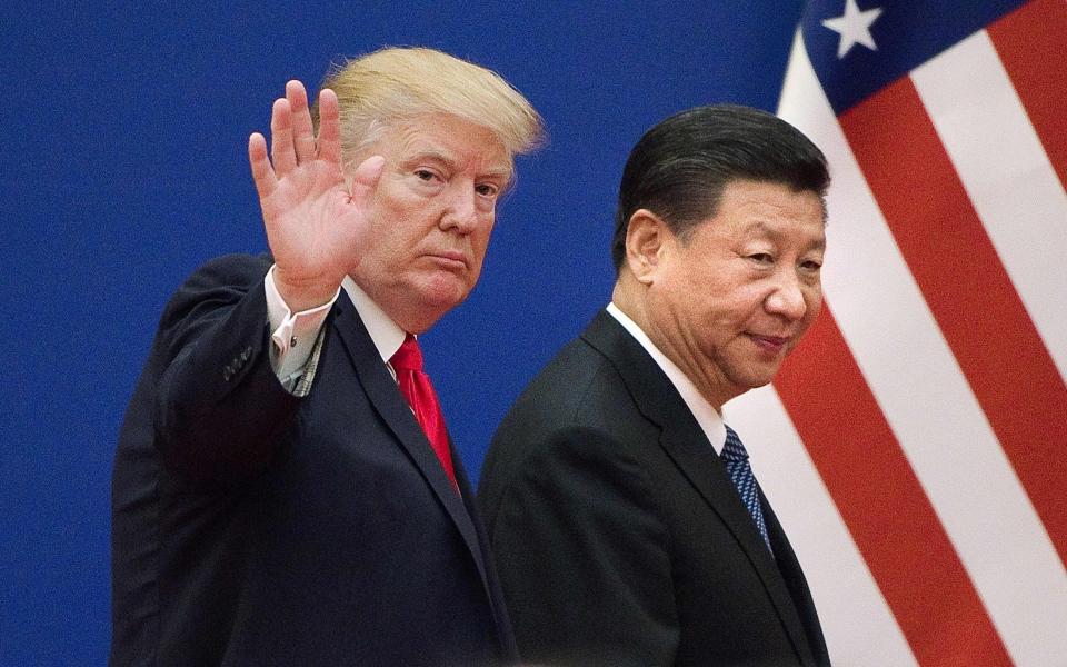 Collision course: US President Donald Trump and China's President Xi Jinping - AFP